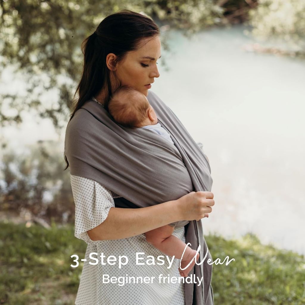 Mother cuddling newborn in Boba Baby Wrap Carrier for comfort and closeness