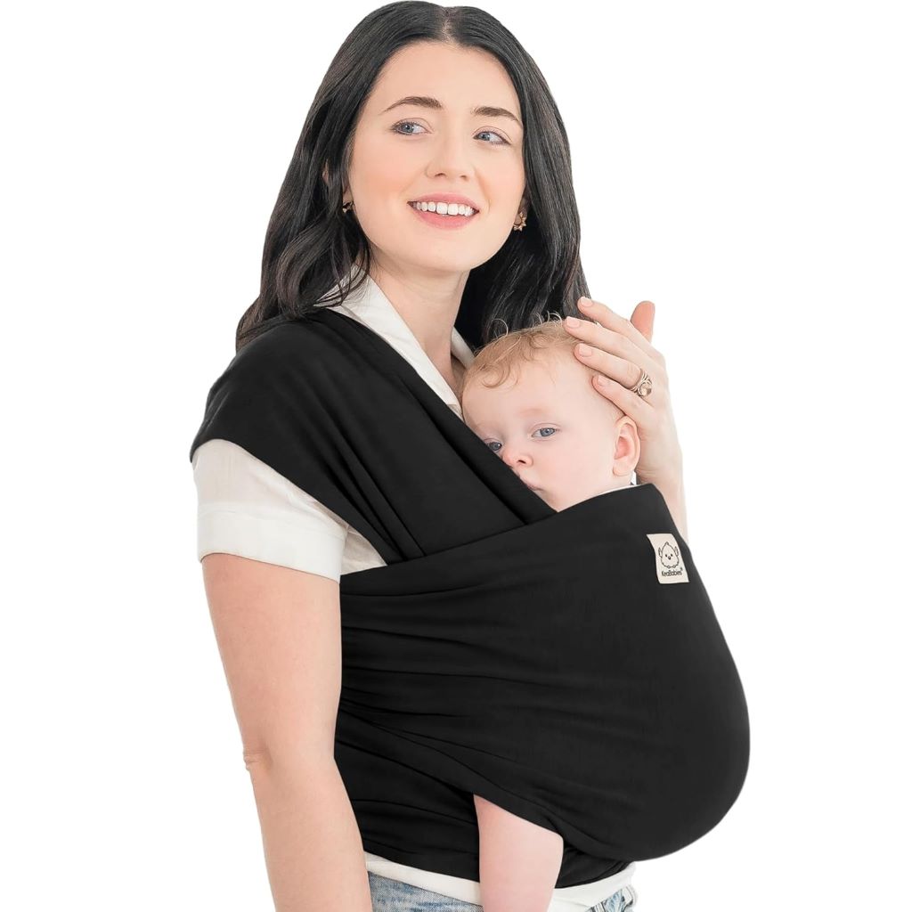 Parent wearing baby in KeaBabies black baby wrap carrier, hands-free and comfortable