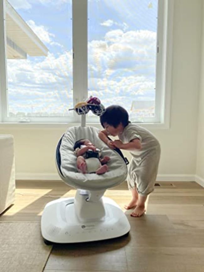 Baby enjoying the 4moms MamaRoo swing with 5 unique motions and Bluetooth control
