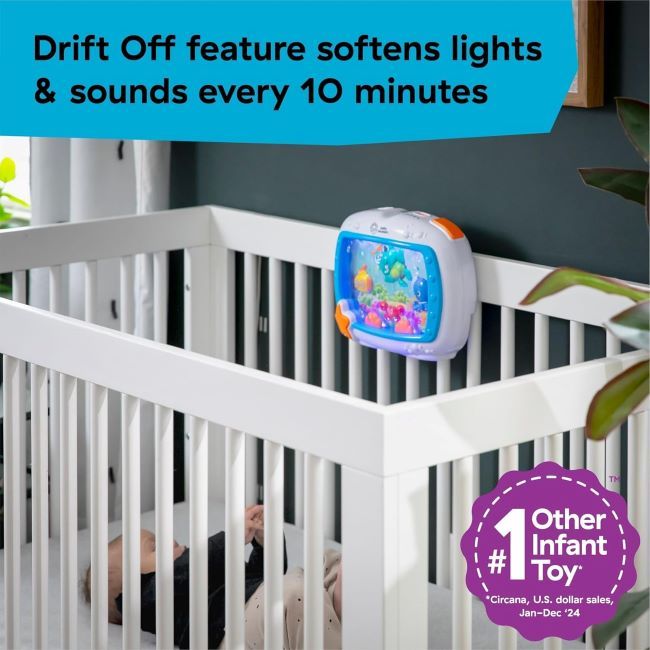 Musical crib toy Baby Einstein Sea Dreams Soother creating a calming underwater light show for newborns.