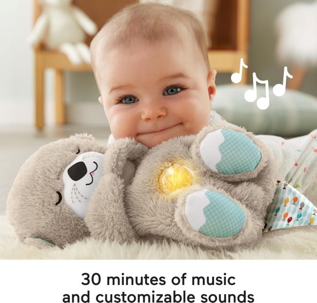 Soft Fisher-Price Soothe 'n Snuggle Otter plush sound machine helping calm newborn baby