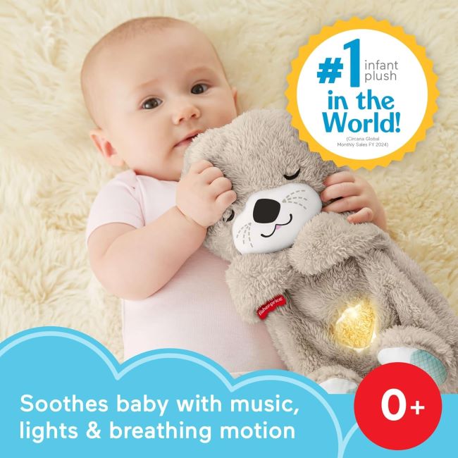 Newborn cuddling with Fisher-Price Soothe 'n Snuggle Otter featuring breathing motion and lullabies
