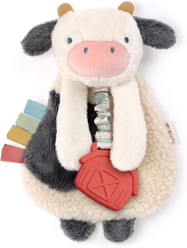 Itzy Ritzy Itzy Lovey cow teether with crinkle sound, soft sherpa and minky fabric, and textured ribbons for babies.