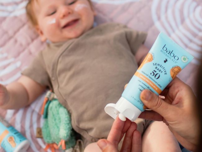 Protect your baby’s sensitive skin with Babo Botanicals SPF 50 mineral sunscreen—fragrance-free, water-resistant, and vegan-friendly.”