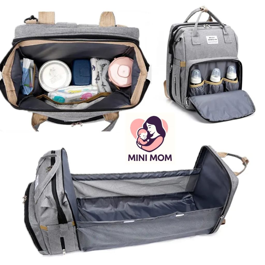 Close-up of organized diaper bag compartments with wipes, diapers, and baby bottles